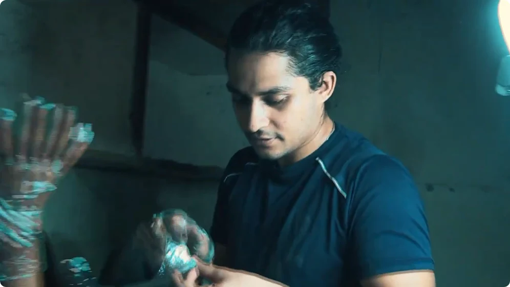 Saran as Guru in a blue shirt in Deepu Rox